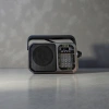 The black portable radio features an ultra-thin design, FM frequency modulation, digital display and is battery-powered Application Scenario